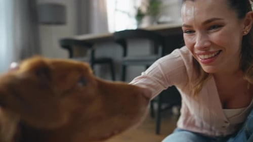 Happy Woman Adore Dog Caressing Fluffy Wool at Home Close Up Pet Enjoying Love