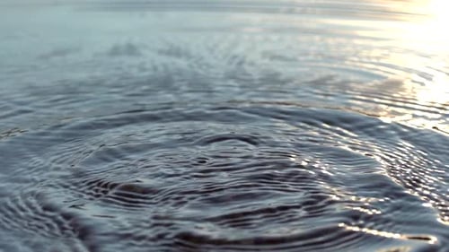 Slow motion footage of splashes on water surface