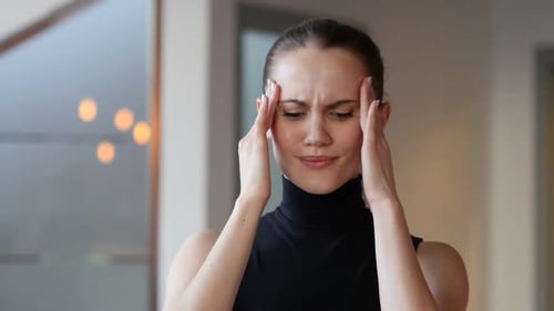 Headache Tense Woman in Office