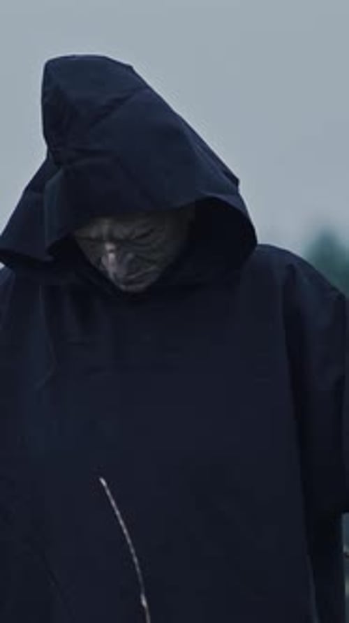 Mysterious dark demon outdoors.