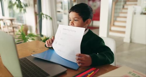 Boy Engaged in Virtual Learning at Home