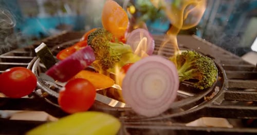 Dropping vegetables on grill