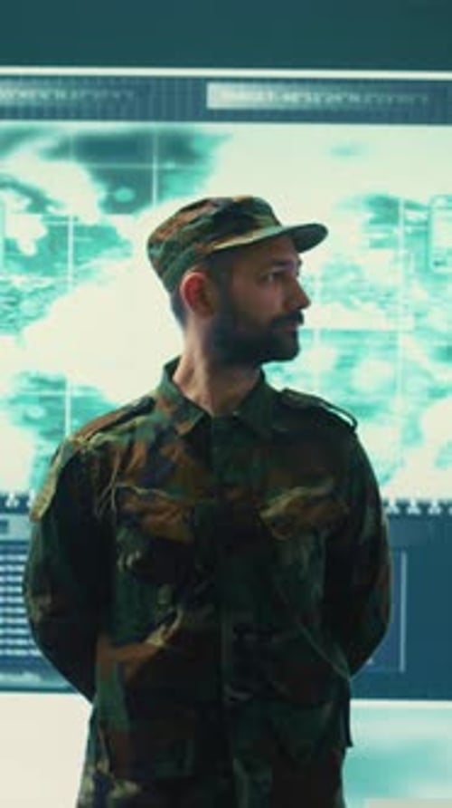 Soldier Stands Guard in a Control Center
