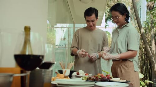 Couple Making Fruit and Vegetable Skewers Together