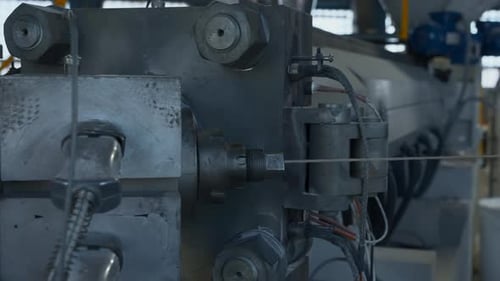 Cable production process, mechanism in a cable factory. Creative. Stretching cable and machinery.