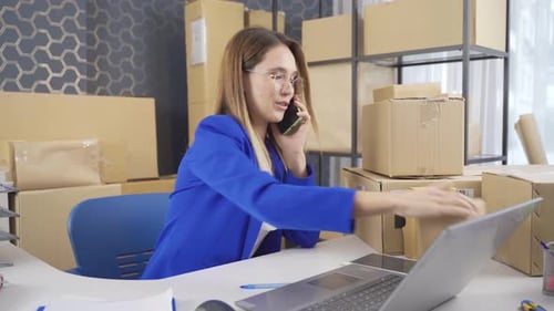 Woman Working at Desk in Shipping Office