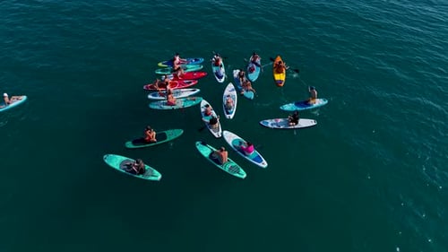 Aerial View Group Paddleboarding at a SUP Festival in the Mediterranean Sea