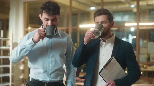 Caucasian Men Businessmen Business Partners Friendly Conversation Dialogue Talking in Office Coffee