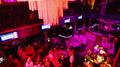 Blurred Aerial View of Crowded Restaurant at Night