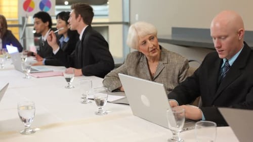 Diverse Business Professionals Meeting at Conference Table