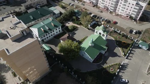 A Stunning Aerial View of a Residential Complex That Features Green Roofs on Buildings Clip