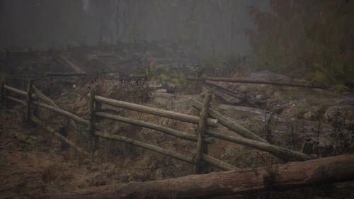 An Old Wood Fence with a Country Field Behind It