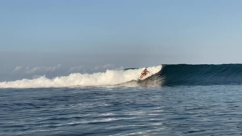 Young Man Surfing in the Ocean