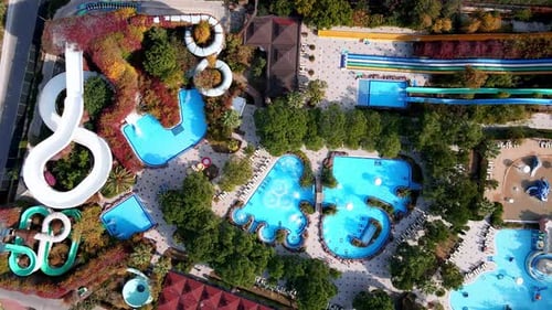 Aerial View of the Aqua Park with Large Pools and Slides in a Luxury Beach Resort