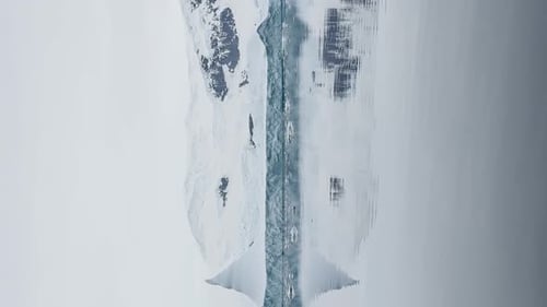 A Huge High Breakaway Glacier is Passing By in the Southern Ocean Off the Coast of Antarctica the