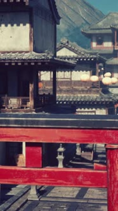 A Red Gate in Front of a Row of Buildings