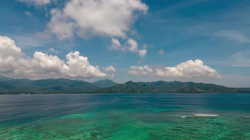 Beautiful Sea and Island with Clouds in Time Lapse on Horizon