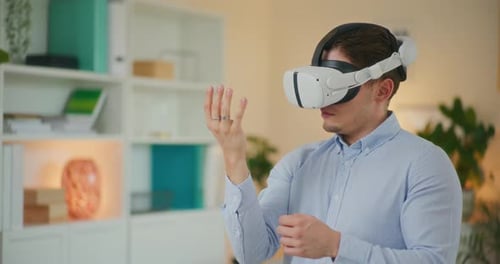 Man Using Virtual Reality Headset Indoors
