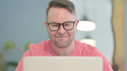 Close Up of Man Doing Video Chat on Laptop