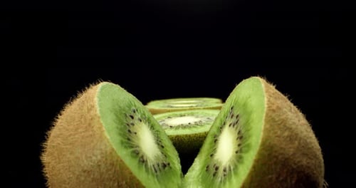 green juicy kiwi fruit cut in half super close up shoot fly over 4k high quallity shoot on dark back