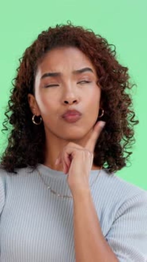 Woman, student and thinking on green screen with choice for future, college education