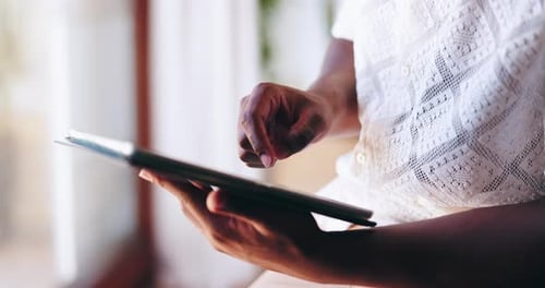 Adult Hands Touching a Tablet