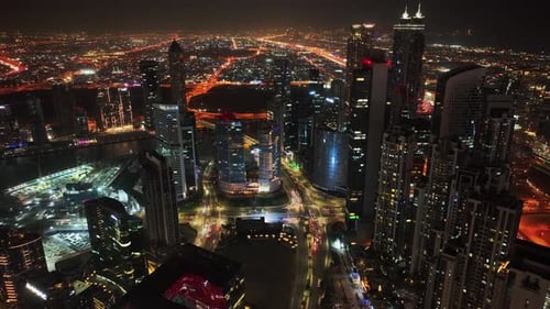 Panoramic aerial view of Downtown Dubai skyline buildings, luxury hotels at night