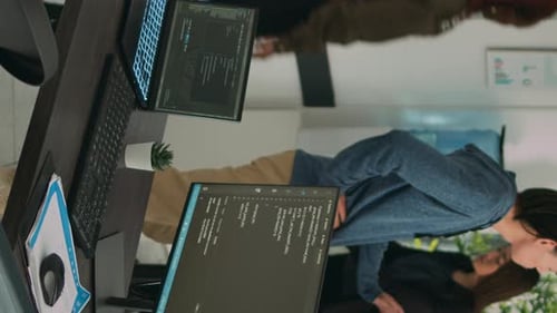Vertical Video African American Coder Using Computer to Write Code and Develop Algorithm Program