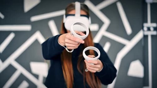 Woman Playing with Virtual Reality Headset Indoors
