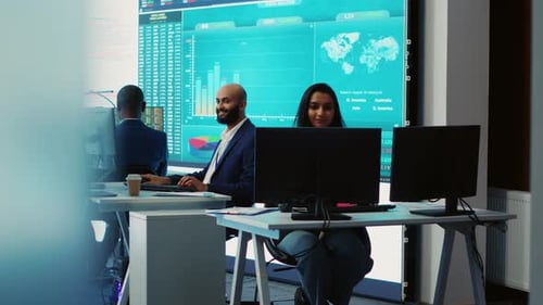 Forecast Affiliates Working in Coworking Space Office to Review Latest Business