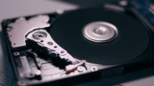 Macro Close Up of Working Opened Hdd Drive Hard Disk Move of Writing Reading Magnetic Head