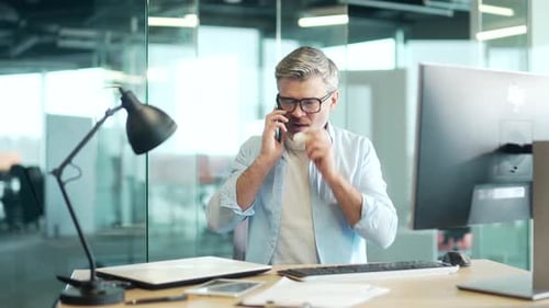Sick Man on Phone Call in Office