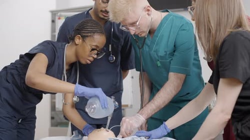 First aid training: infant bag valve mask resuscitation in clinic on a baby
