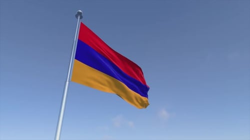 Armenian National Flag Waving in the Wind against Blue Sky