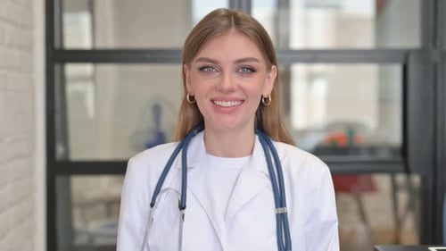 Portrait of Smiling Female Doctor in Clinic
