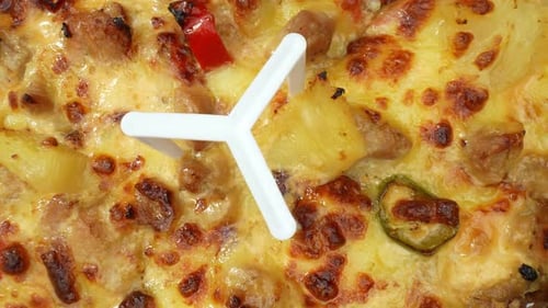 A cheese pizza with sausage in Macro close-up video. 4K.