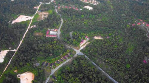 Amazing cinematic 4K residential drone footage after deforestation issue consists of many homes, roa