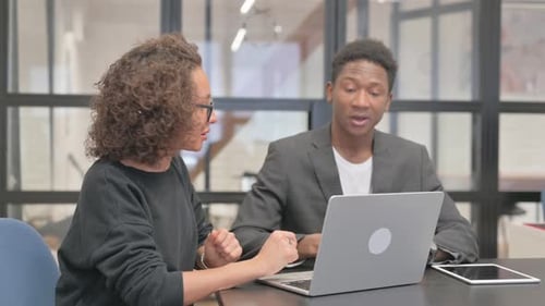 Collaborative Discussion with Laptop in an Office