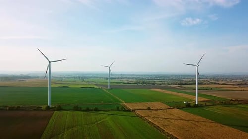 Aerial Drone View. Wind Turbines and Agricultural Fields on a Summer Day. Ver 4