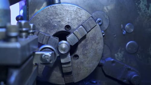 Round rotating detail in turning lathe. Elements on a metal lathe machine.