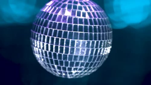 Rotating Mirror Disco Ball Reflecting Colorful Lights