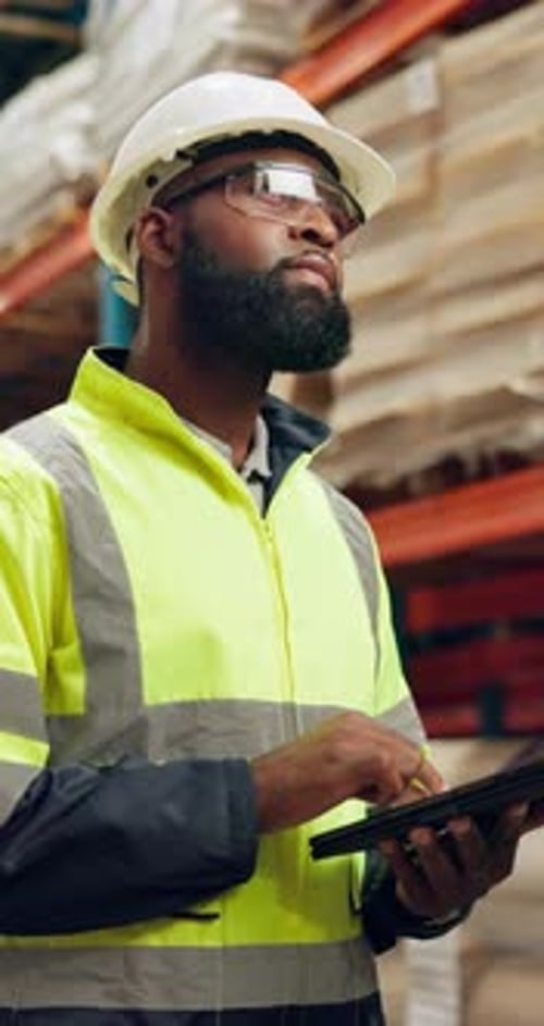 Inventory, check and man in warehouse with tablet for logistics of storage, stock or planning
