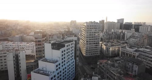 Sweeping Aerial View of City at Sunrise