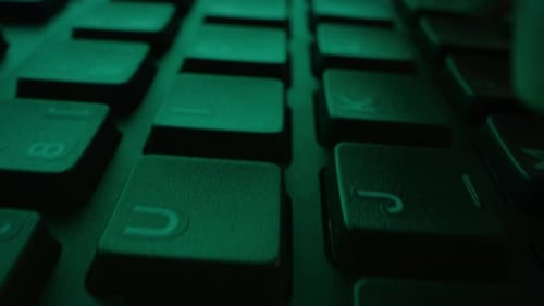 Close-up Moving Macro Shot: Person Typing on the Computer Keyboard. Working, Writing Emails, Using