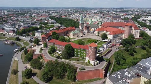 Flyover of the Wawel Royal Castle Cathedral on the Vistula (Wisła) River - Krakow, Poland, a Polish
