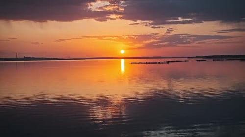 Timelapse of Dramatic Sunset Over Lake Horizon