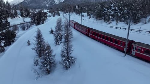 Aerial view of train in snow, Switzerland.
