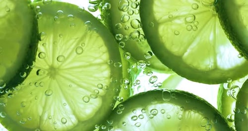 Lime Slices and Bubbles Underwater Close Up