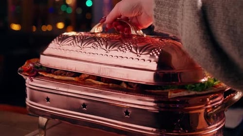 Elegant Copper Serving Dish with Meats and Vegetables