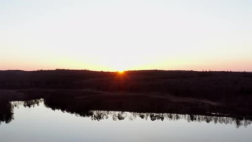 Sunset over lake Scenic view of beautiful sunset or sunrise